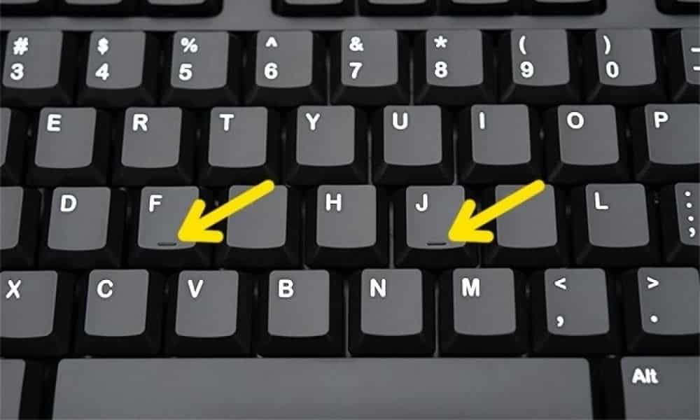 Por que as teclas F e J nos teclados de computador têm uma pequena linha?